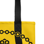 Detalle de las asas de la bolsa tote mostrando costuras reforzadas y acabados de la cinta de algodón.