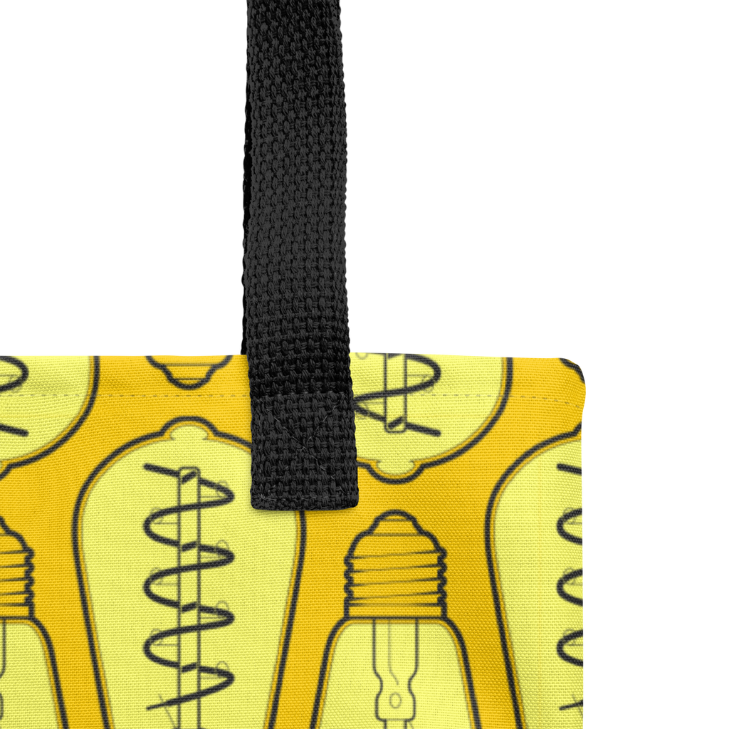 Detalle de las asas de la bolsa tote mostrando costuras reforzadas, textura de la cinta y acabados.