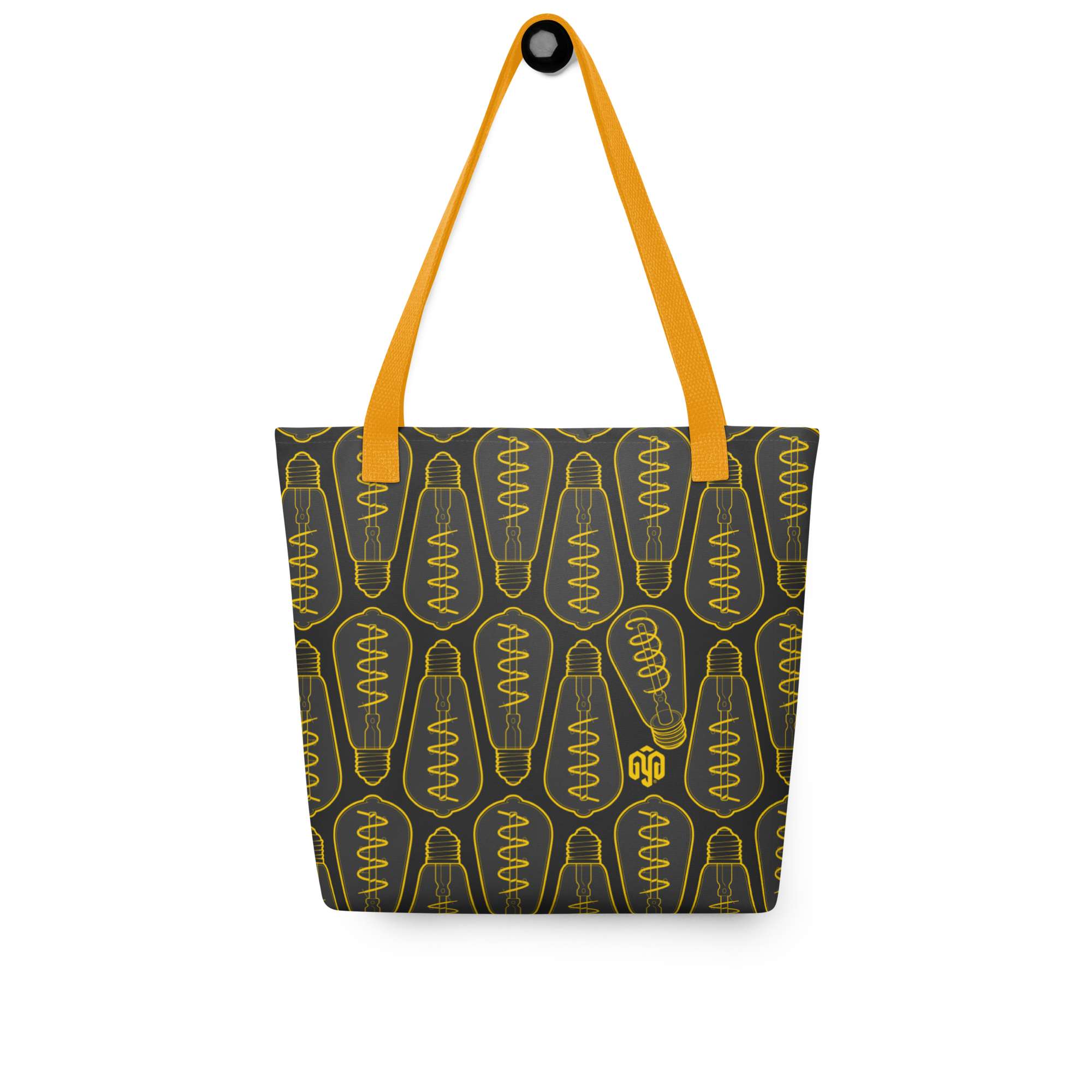 Bolsa tote colgada, vista frontal, con patrón isométrico de bombillas apagadas en tonos oscuros y un foco distinto integrado en el diseño.