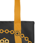 Primer plano de las asas de la bolsa tote con detalle de costuras, remates y textura de la cinta.